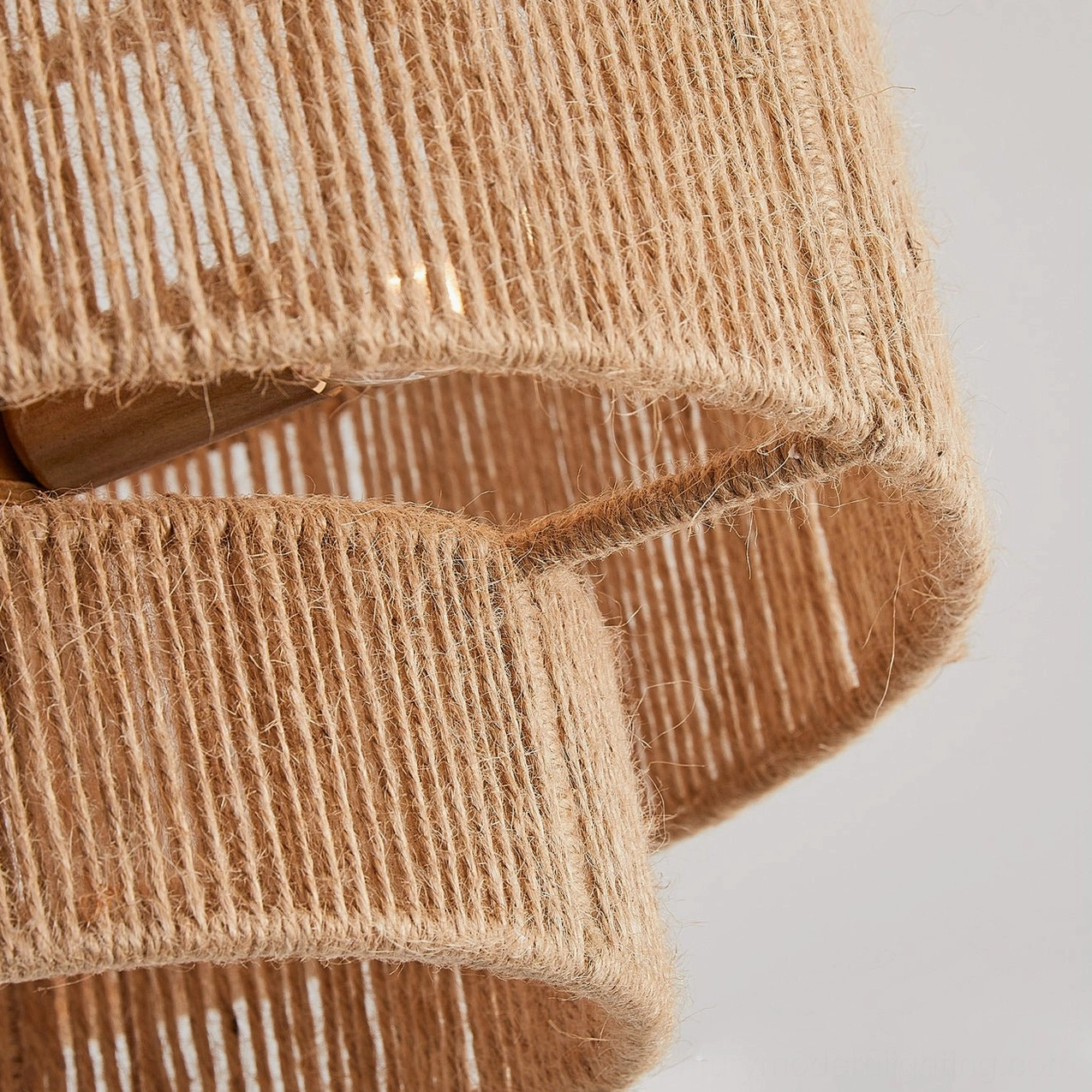 Macro close-up of natural jute woven double-tier shade structure highlighting handcrafted hemp rope construction