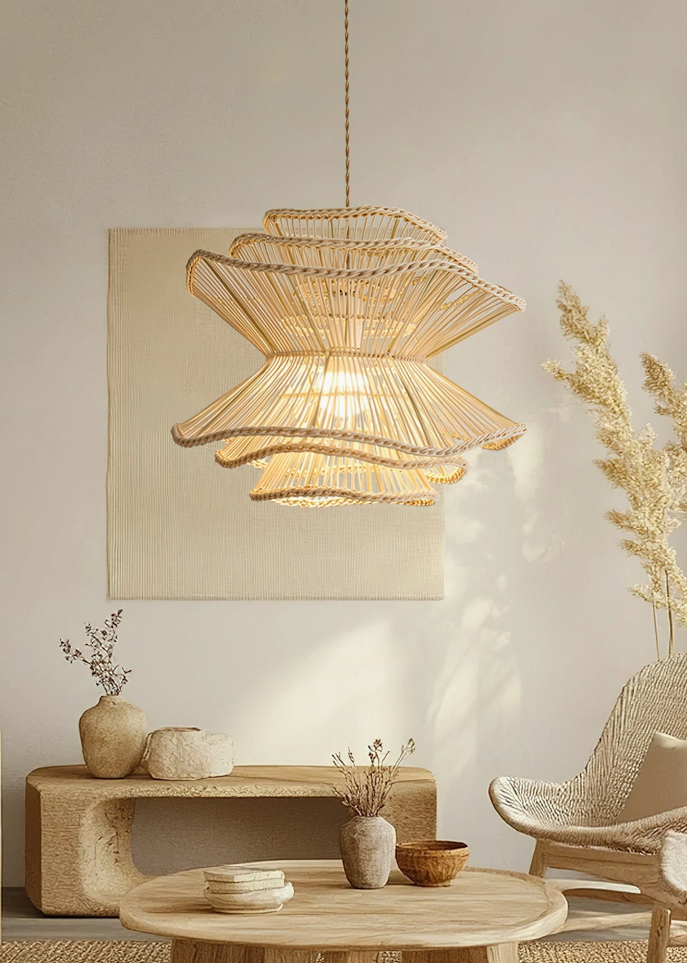Single Sombra rattan pendant lamp in wabi-sabi living area with low-profile furniture, neutral warm beige tones and layered flared design