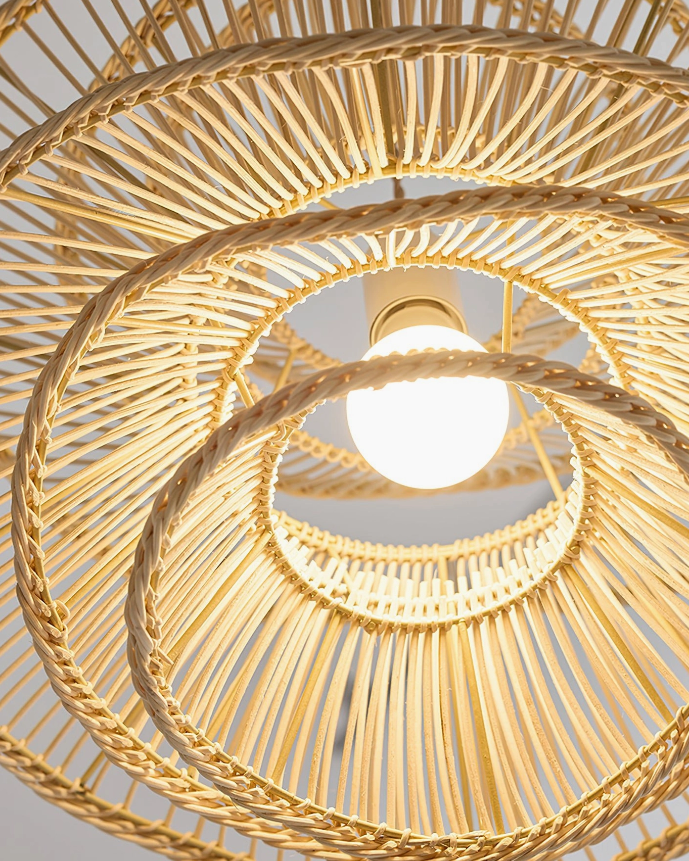 Sombra handcrafted rattan pendant light mid-century modern style detail shot showing artisanal weaving technique and natural material texture