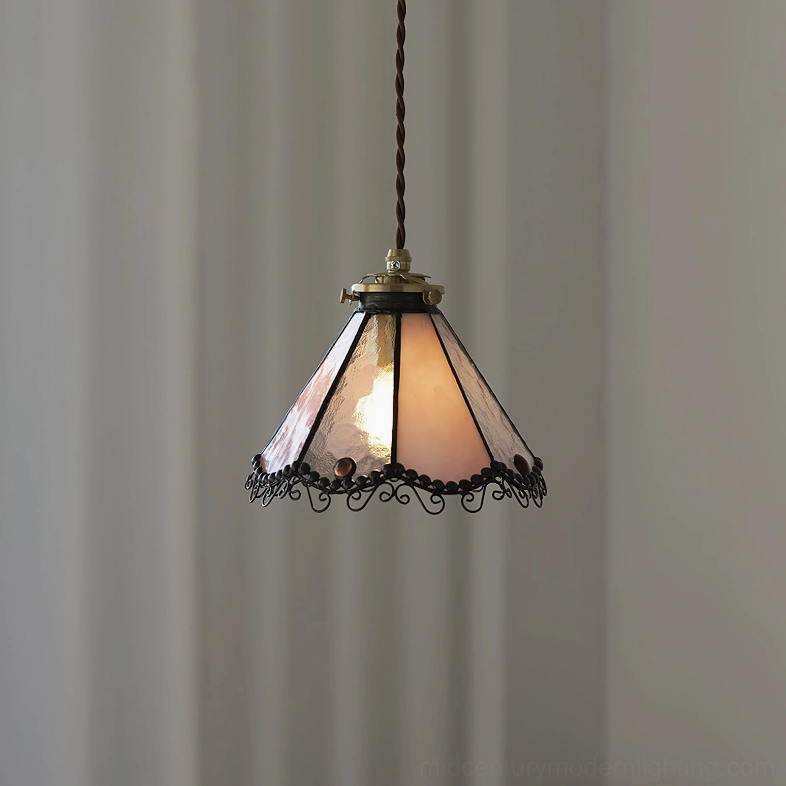 Sonoma stained glass pendant lamp with peach gradient glass shade, brass hardware, and twisted suspension cord front view
