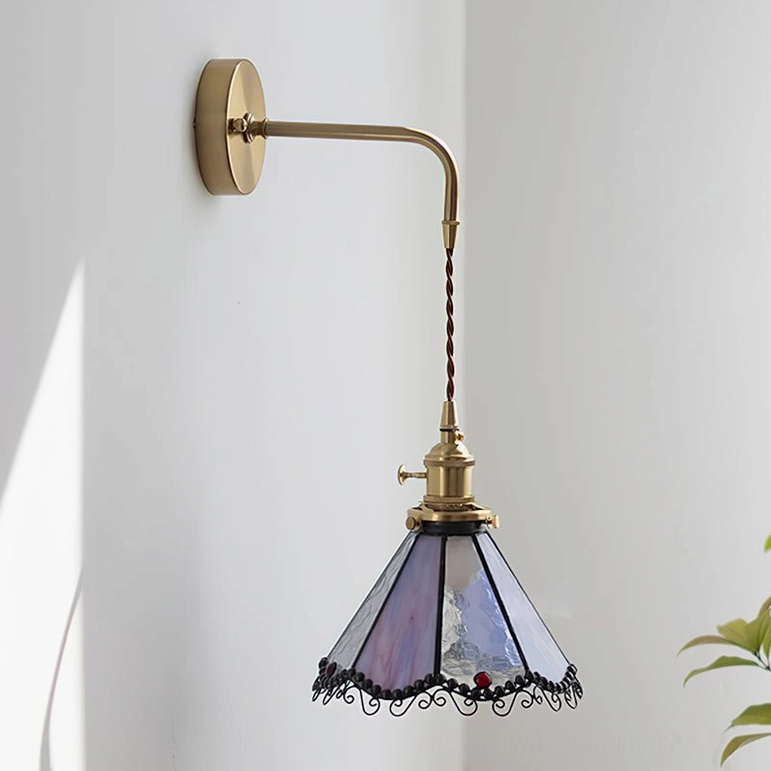 Sonoma Tiffany Model B wall sconce in purple and blue stained glass with extended arm and comprehensive brass mounting system
