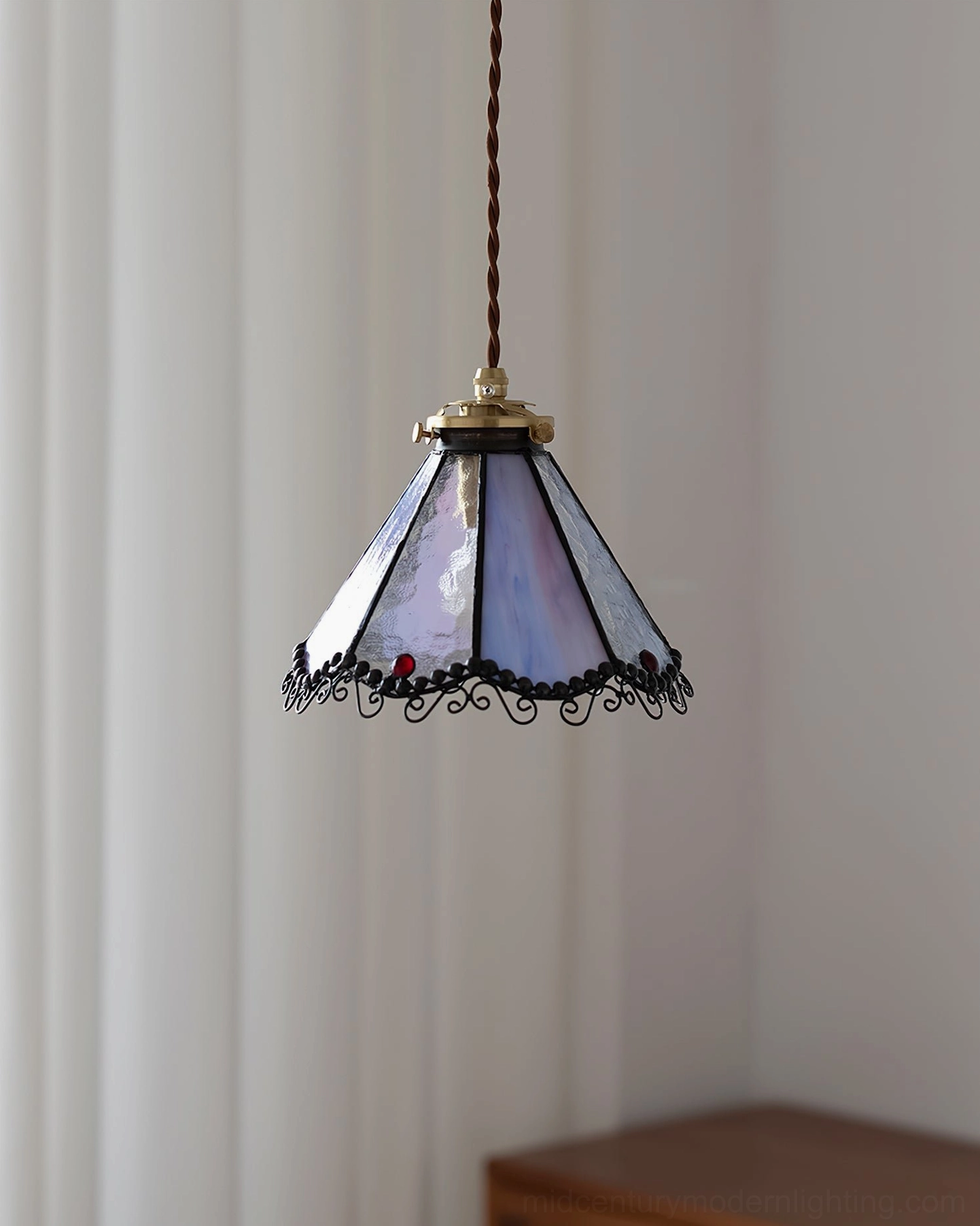 Distant view of Sonoma stained glass ceiling pendant lamp in home interior with natural light filtering through curtains and furniture