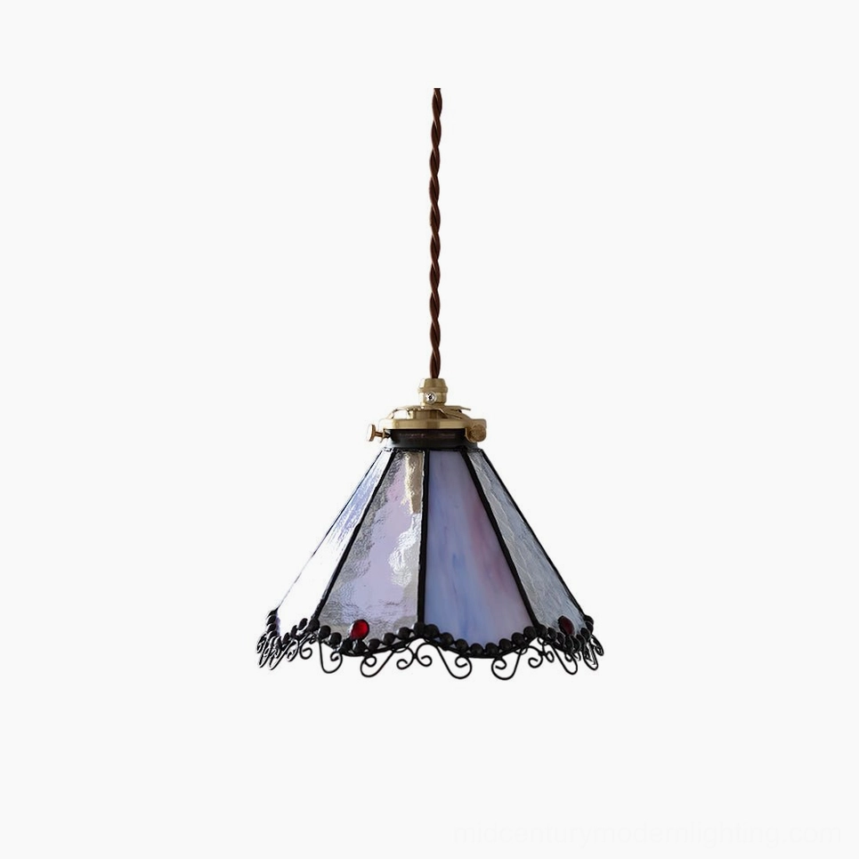 Sonoma Tiffany stained glass pendant lamp with purple and blue gradient glass panels and ornate black trim, front view studio shot