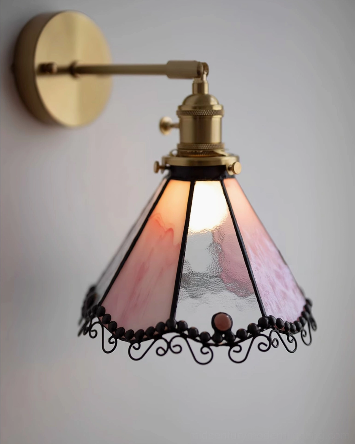 Sonoma Tiffany stained glass wall sconce detail showing brass fixture, glass panels, and ornamental beadwork craftsmanship