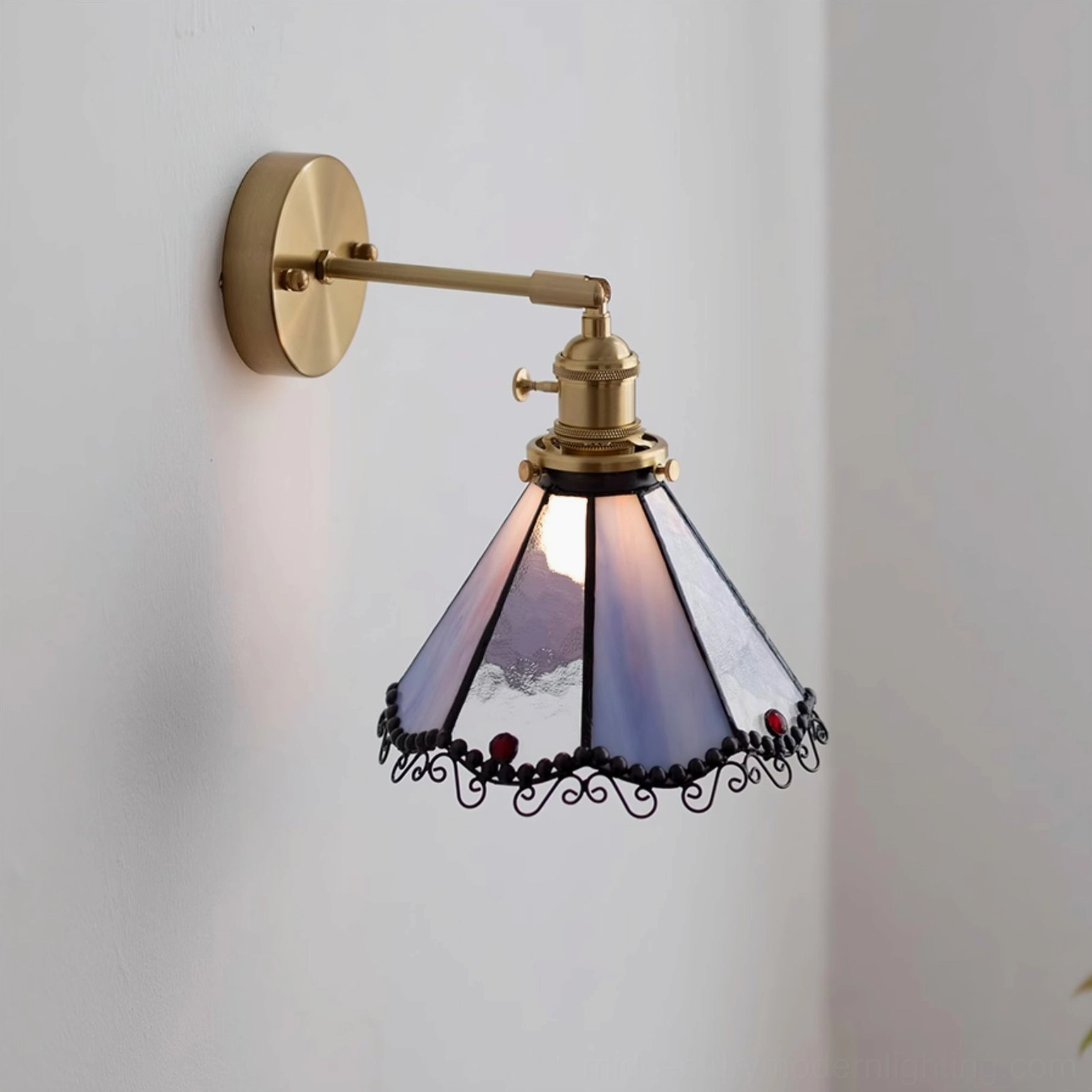 Close-up front view of Sonoma Tiffany stained glass wall light featuring purple glass with red decorative beads and brass gold fixture