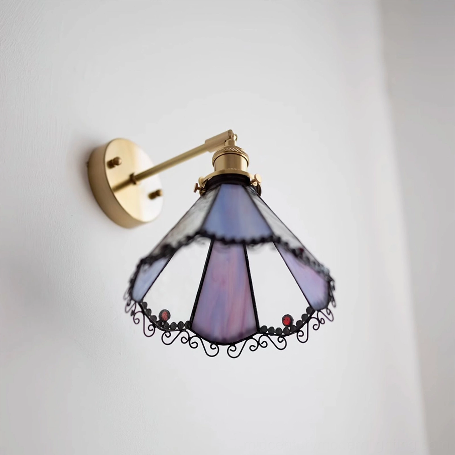 Sonoma Tiffany wall sconce in interior room setting demonstrating ambient lighting effect and decorative impact on wall surface