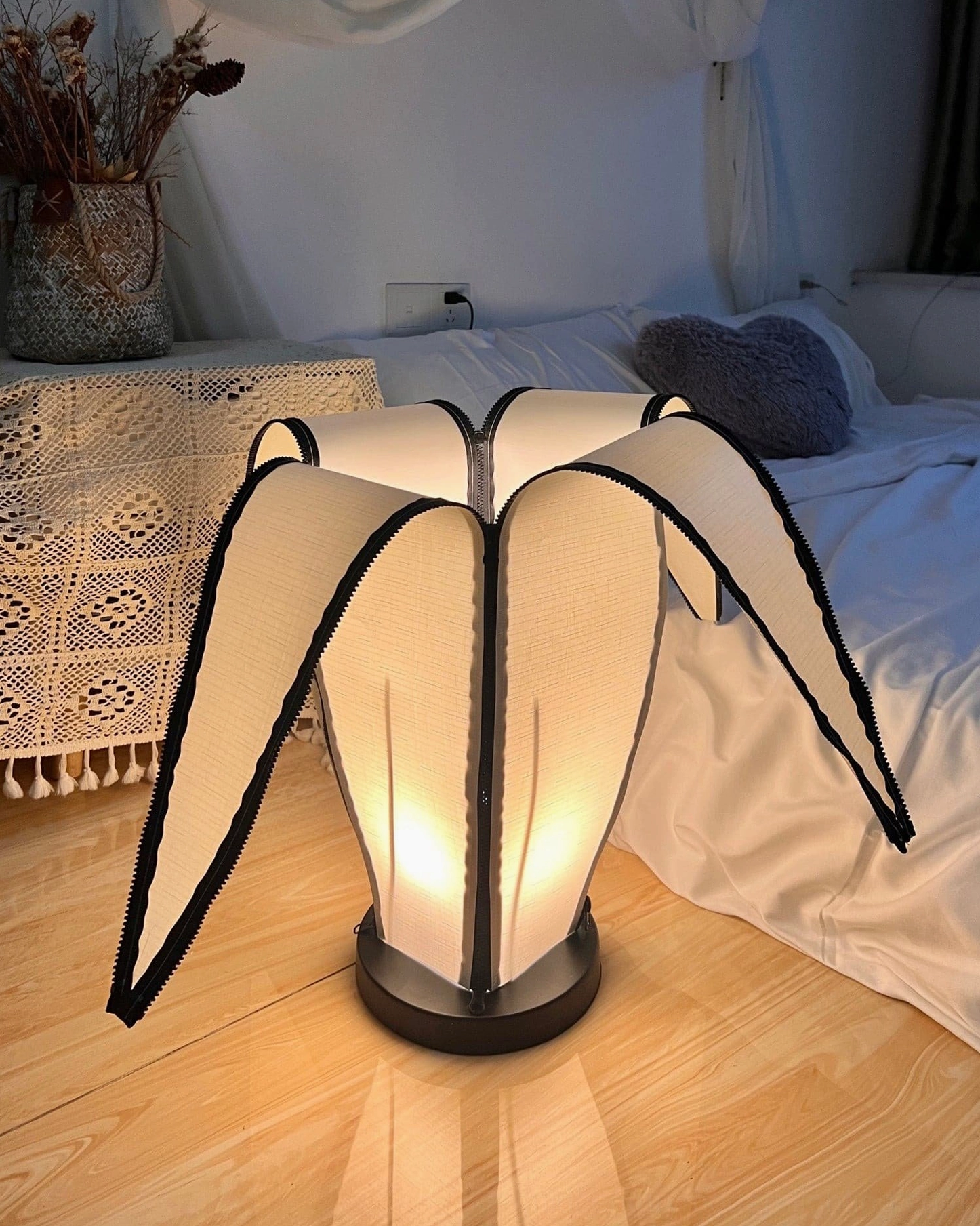 Sophisticated banana-shaped table lamp accent in neutral tone interior design scheme