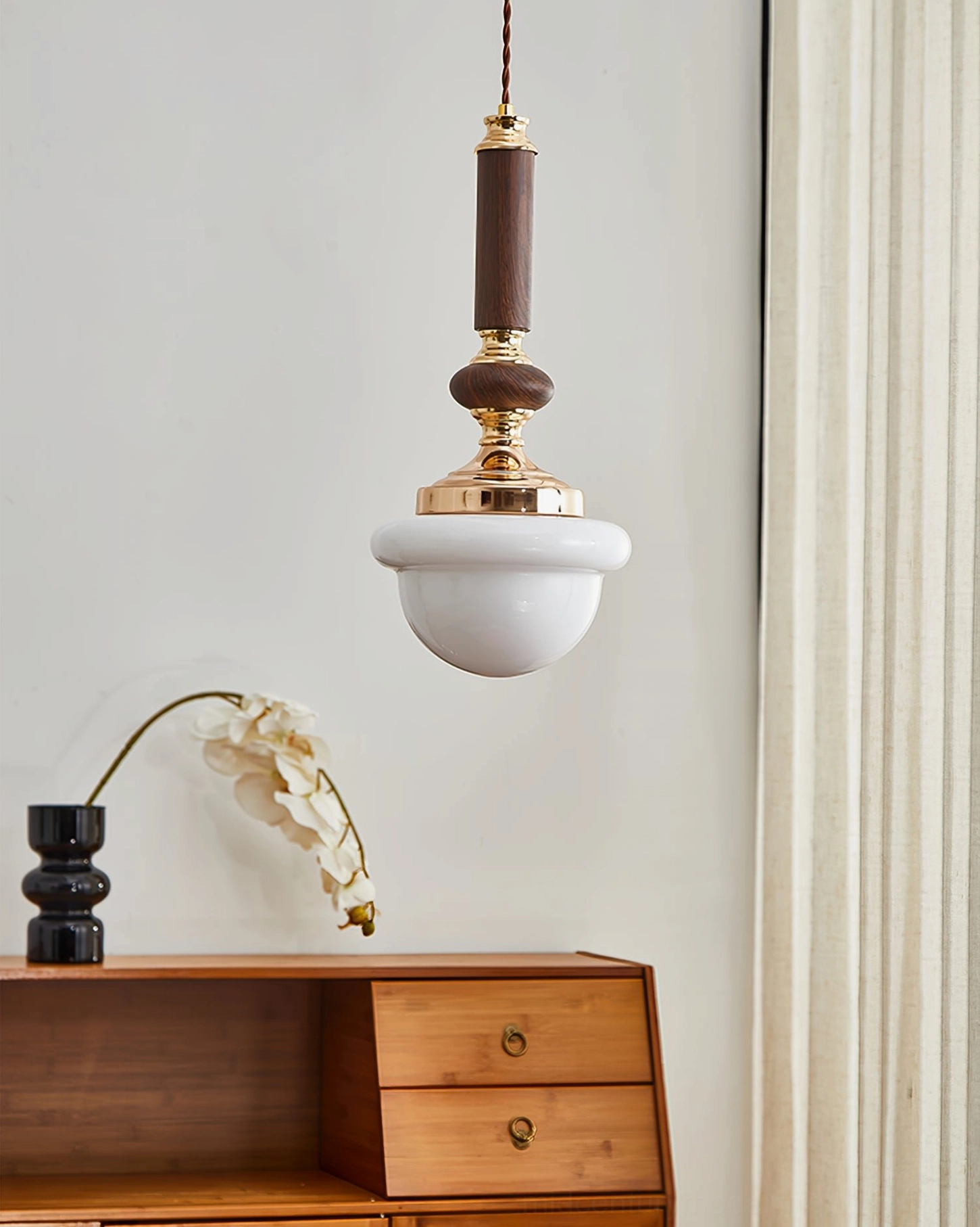 Sorbonne pendant light styled in vintage interior with wooden cabinet and warm gold accent lighting