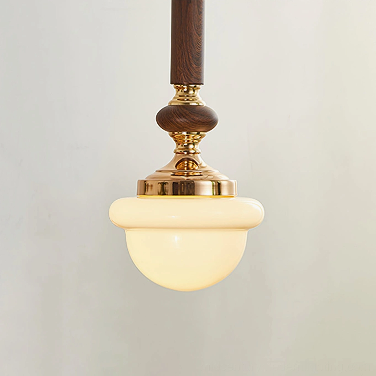 Sorbonne pendant light front view showing rounded opal glass and wood-finished metal frame