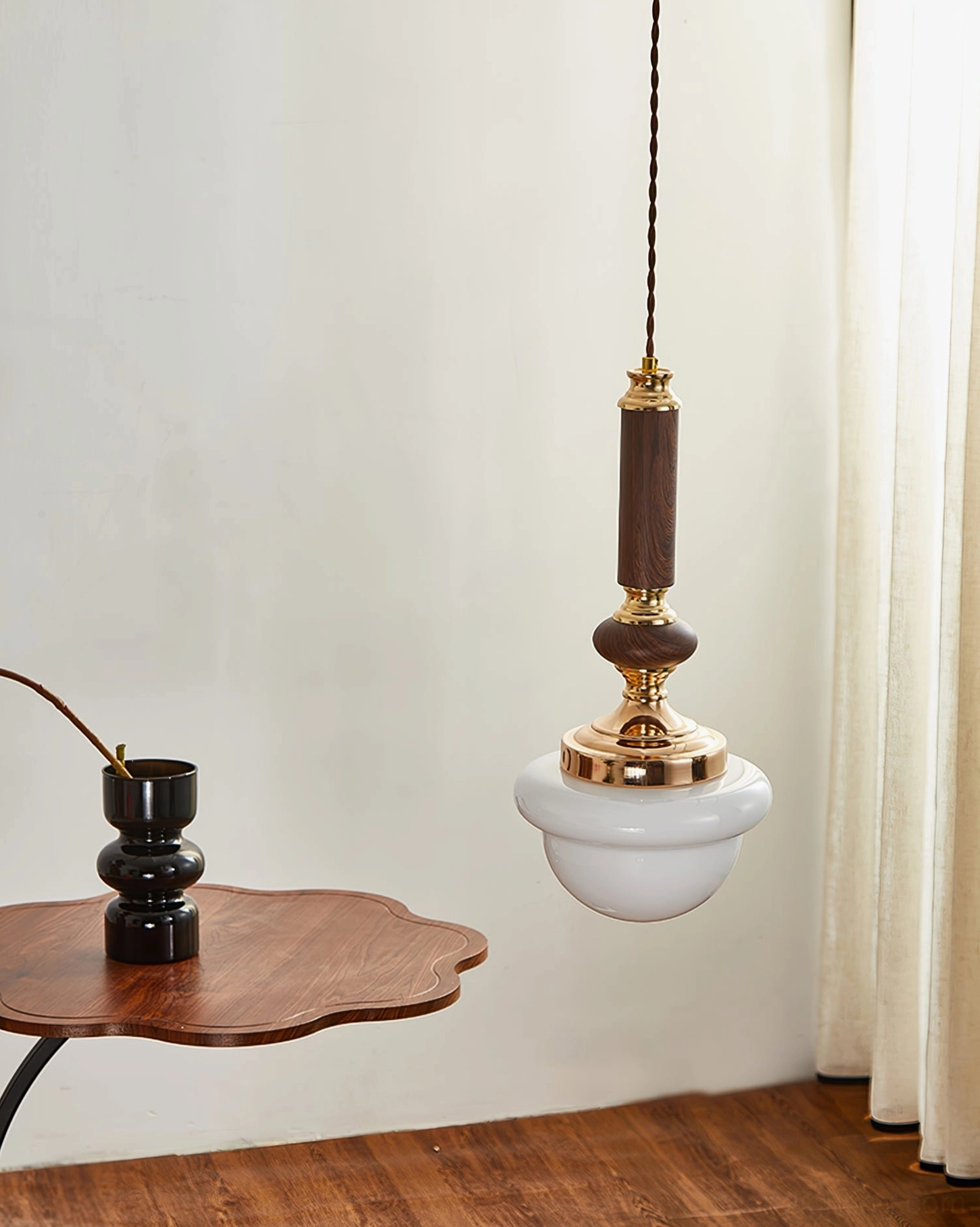 Sorbonne mid-century modern pendant in walnut finish hanging in contemporary home setting