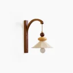 Soren pleated linen wall sconce with walnut wood bracket and hand-turned wooden beads - front studio view