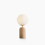 Soren travertine globe table lamp front view with frosted glass sphere on yellow stone base, minimalist wabi-sabi style against white background