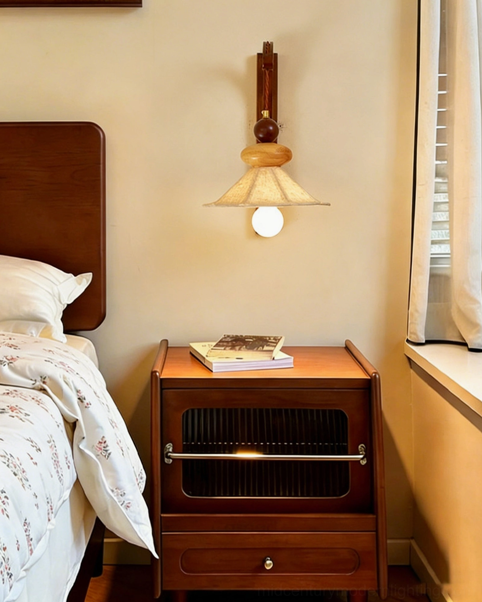 Soren pleated wall sconce creating warm ambiance on bedroom nightstand - bedroom perspective