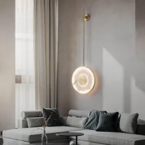 Sorle wall lamp installed in modern luxury living room, glowing warm ambient light with sofa and contemporary decor