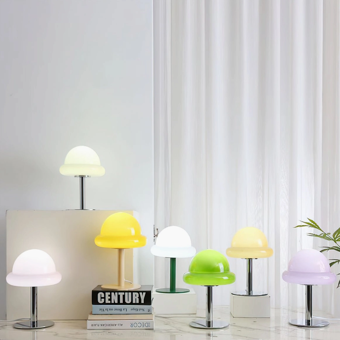 Collection of pastel-colored retro mushroom table lamps on shelf display with books and indoor decor styling