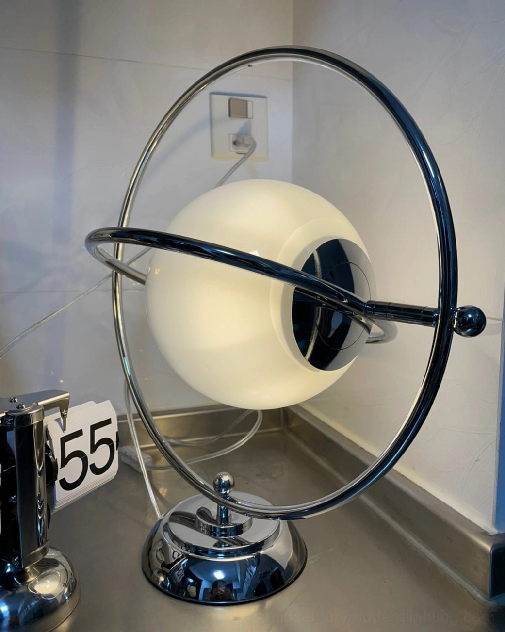 Space age planet lamp with adjustable orbital ring metal frame construction