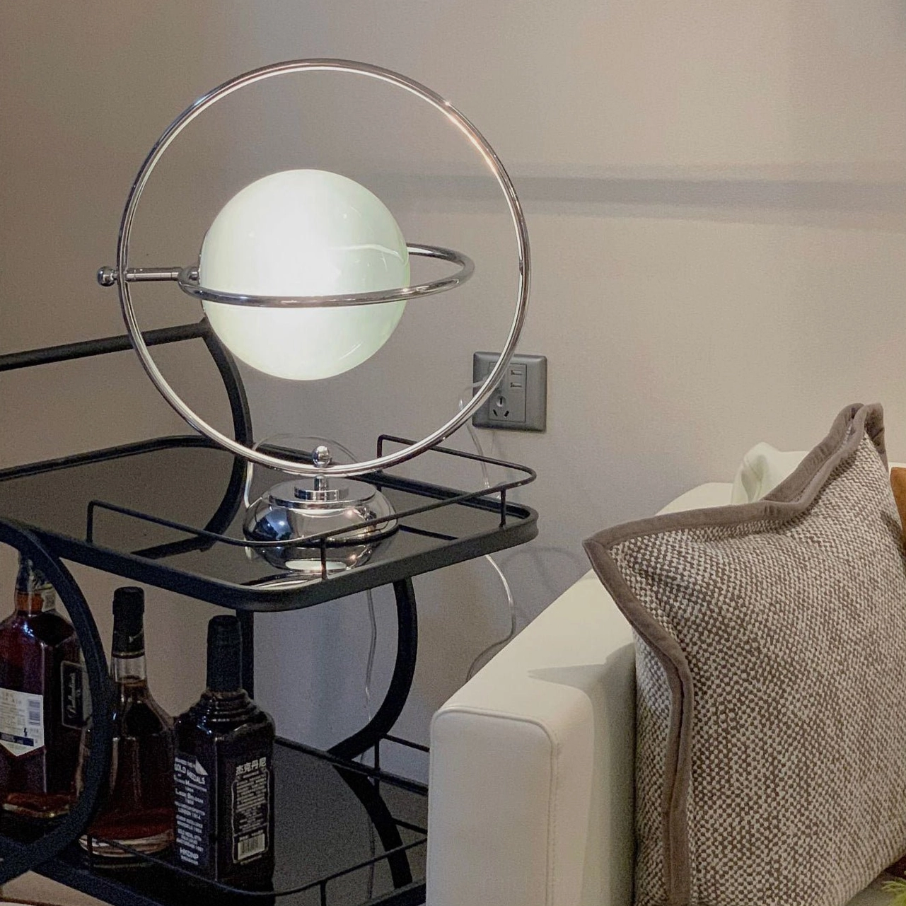 Space age design planet table lamp 360 rotating ring on modern tabletop setup