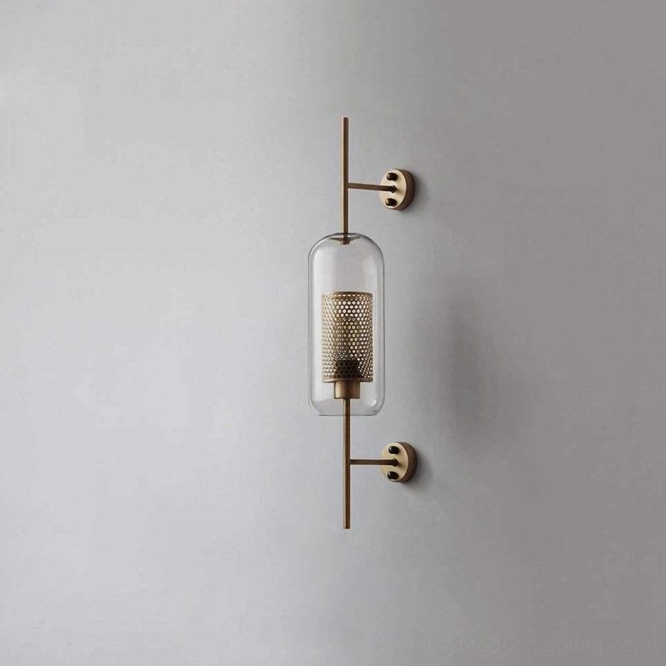 Modern glass wall sconce with spherical clear shade and silver metal finish