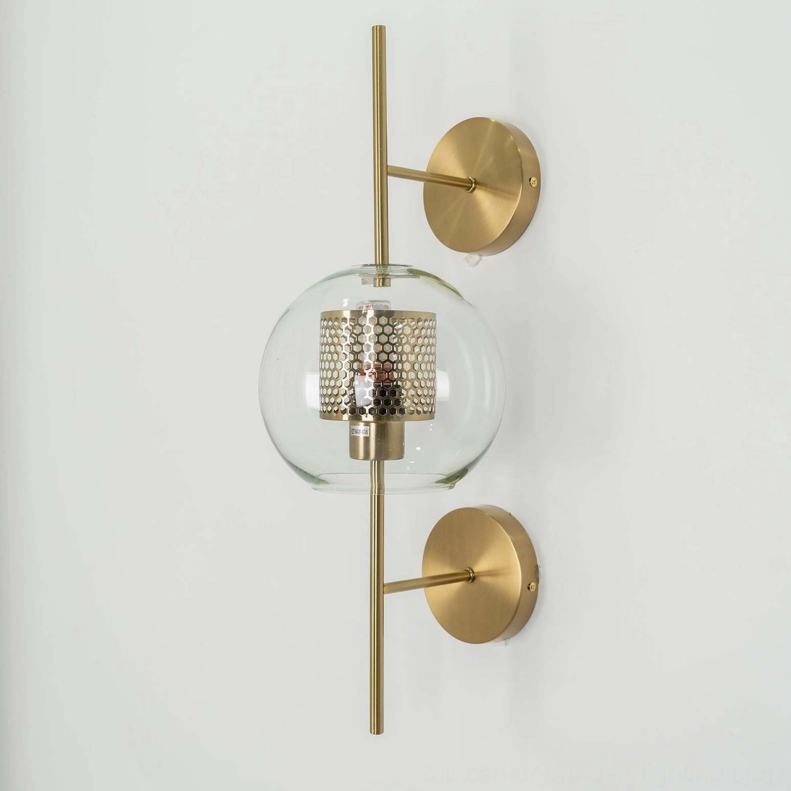Sphere glass wall sconce with silver metal finish and clear glass shade