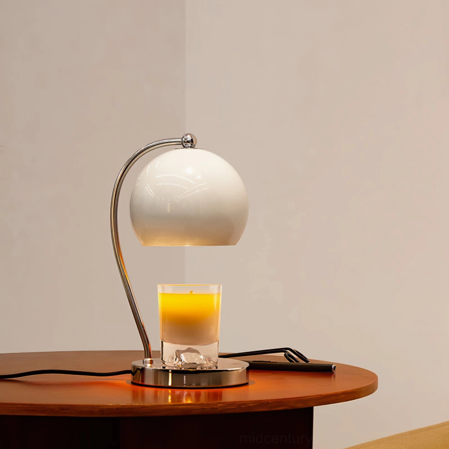 Retro candle warmer lamp with glass sphere shade and metal base architectural photography