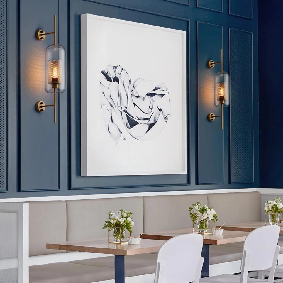 Modern glass wall sconce with spherical shape and sculptural presence