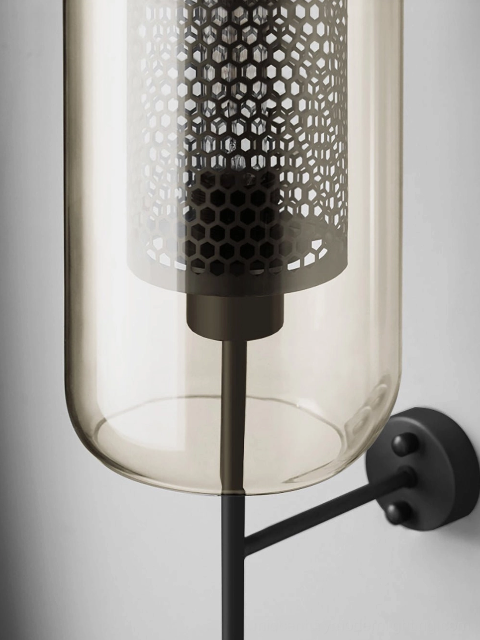 Glass wall sconce showing spherical shade and refined architectural mounting