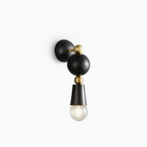 Spindle wall sconce with brass frame and black spherical accents - flat studio view