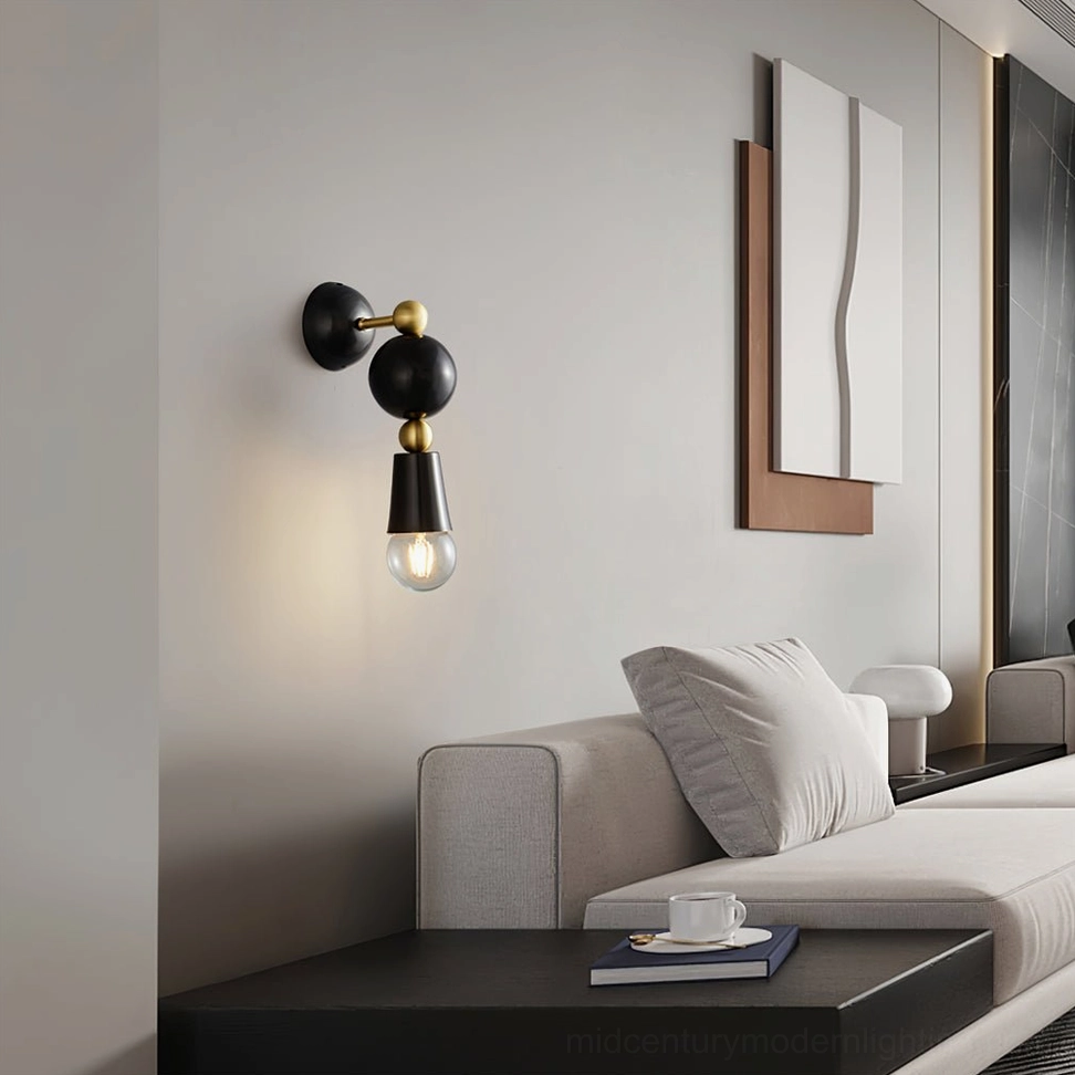 Spindle wall sconce in contemporary living room above console table with warm glow