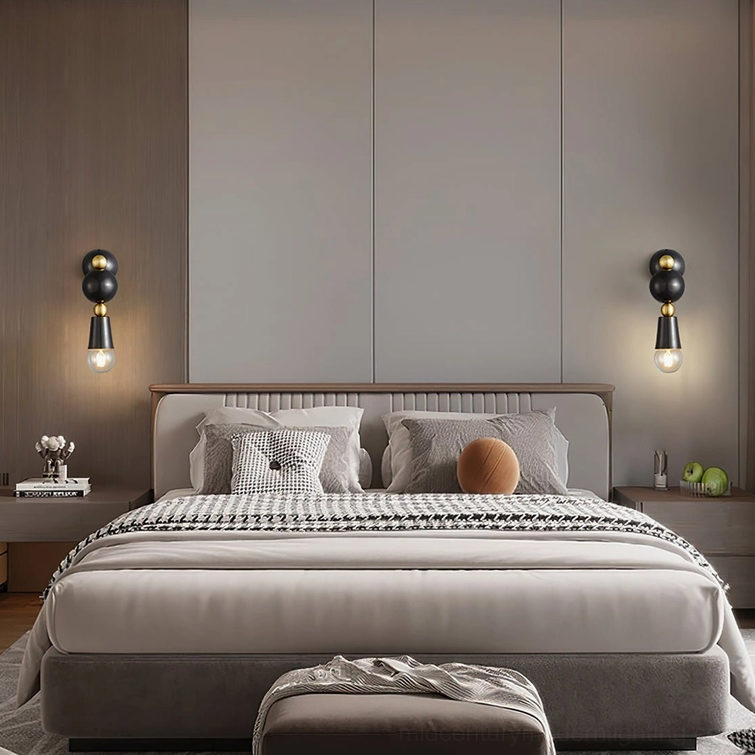 Paired Spindle wall sconces in luxury master bedroom for symmetrical vanity lighting