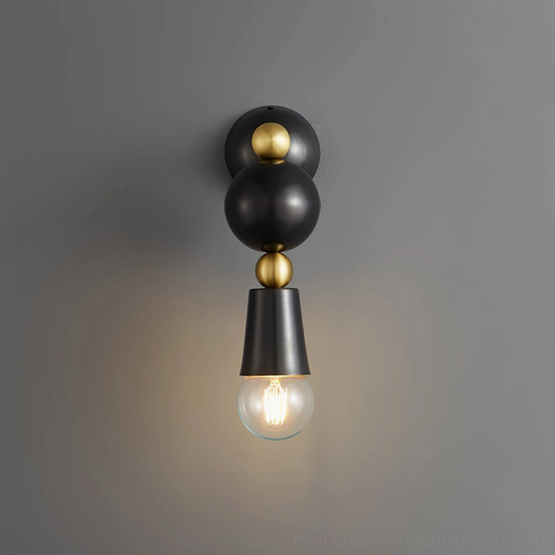 Spindle wall sconce front view highlighting stacked spherical design elements