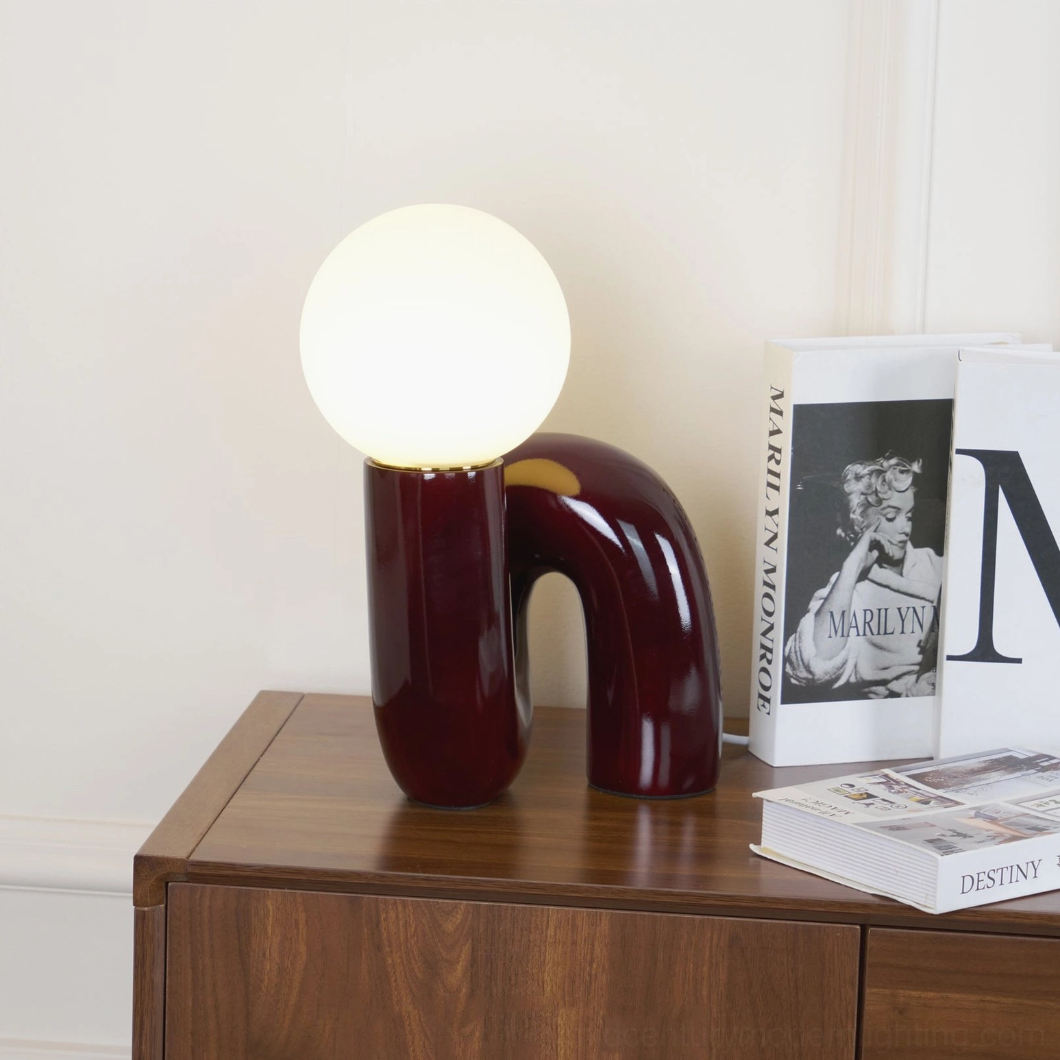 Minimalist Spiral Table Lamp side view on wooden furniture with art book styling and home accessories