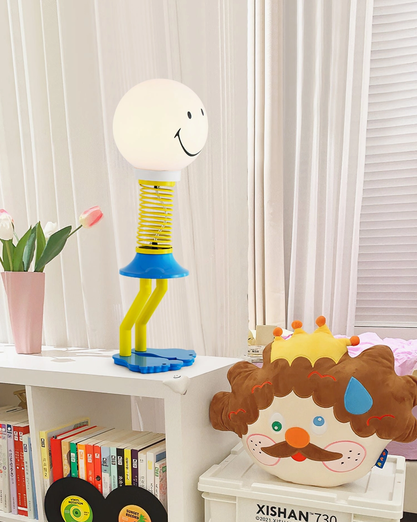 Spiral spring smiley face table lamp complete product shot studio lighting, modern playful desk lamp