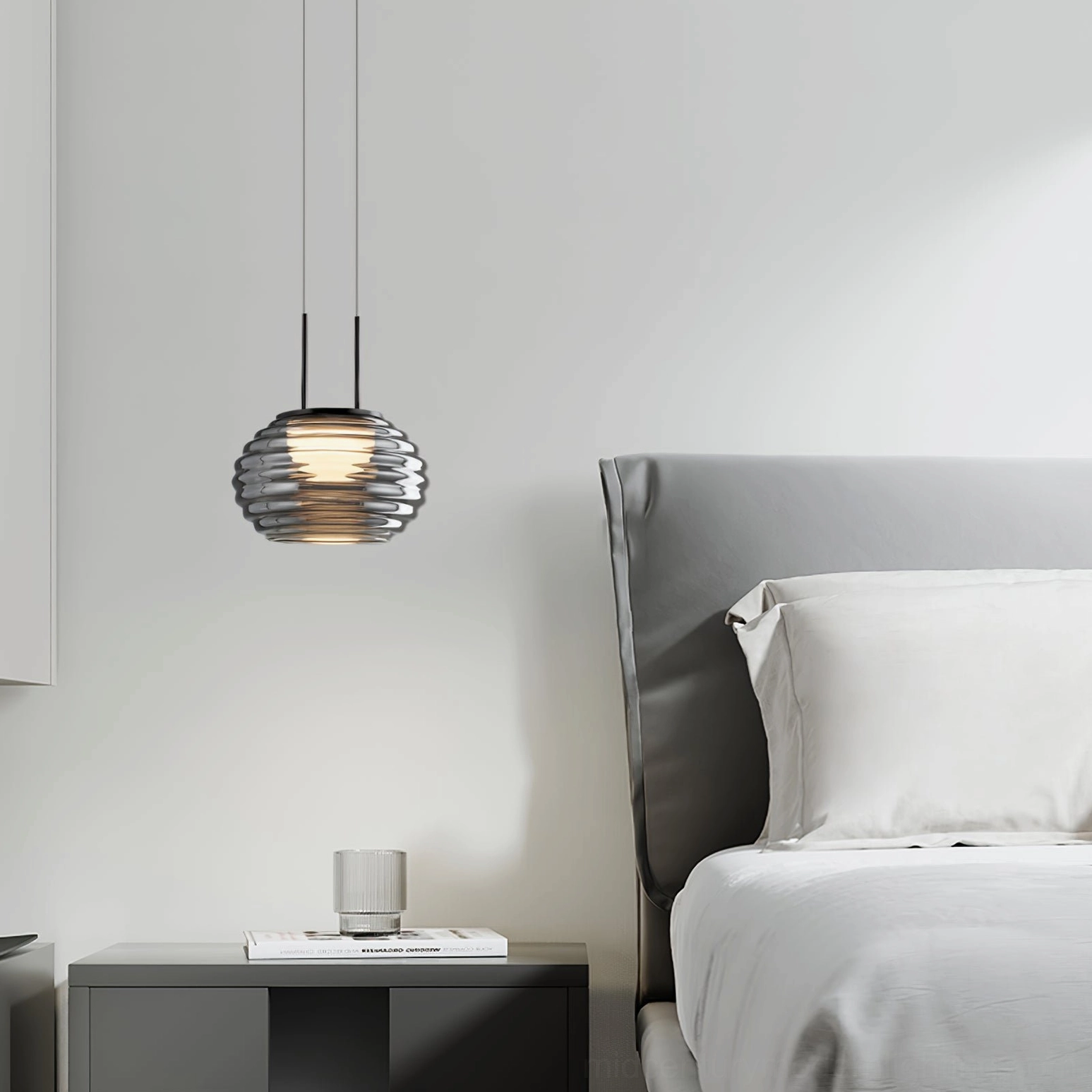 Splugen smoke glass pendant light in master bedroom providing warm ambient illumination above nightstand
