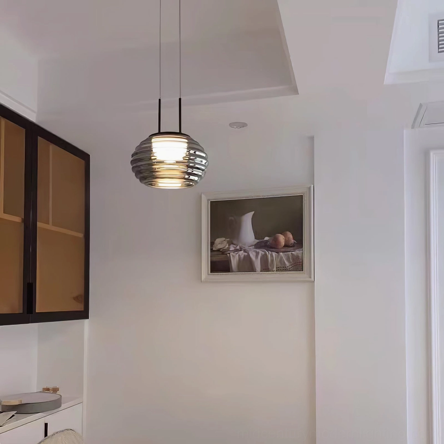 Splugen pendant lamp illuminating modern kitchen dining hallway with subtle warm glow and compact contemporary design