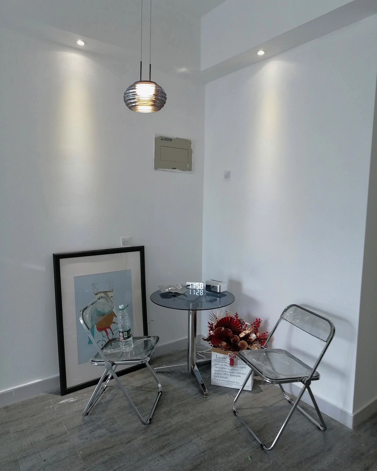 Splugen smoke grey pendant light installed in minimalist bedroom setting with refined aesthetics