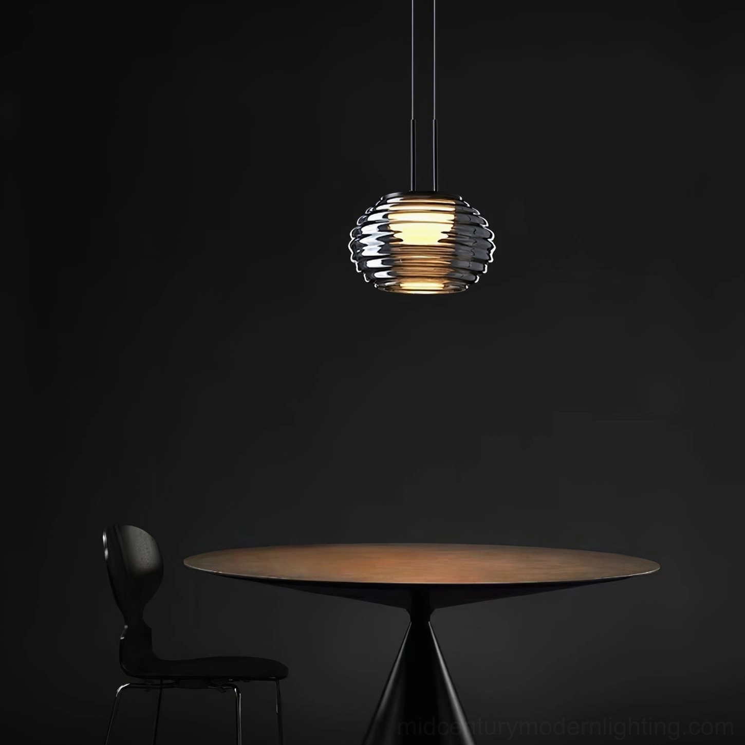 Splugen pendant lamp suspended in modern minimalist dining corner with warm ambient lighting and luxury contemporary style