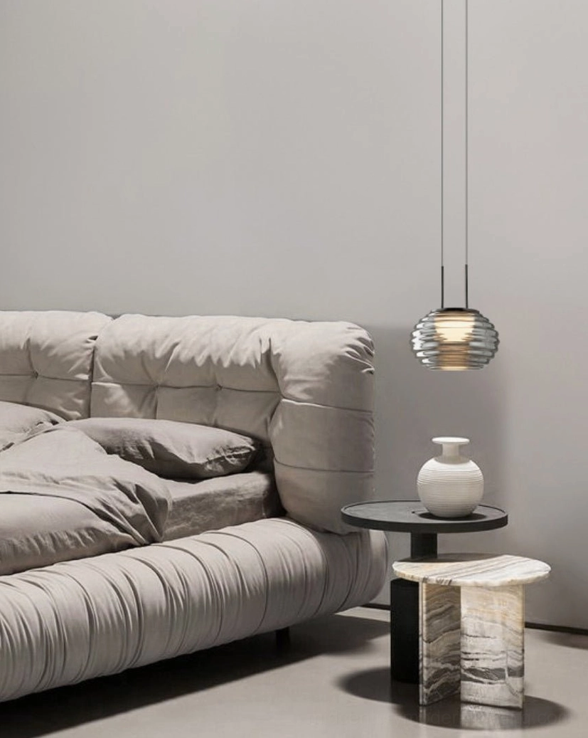 Splugen smoke glass pendant with warm color temperature option creating intimate ambient lighting