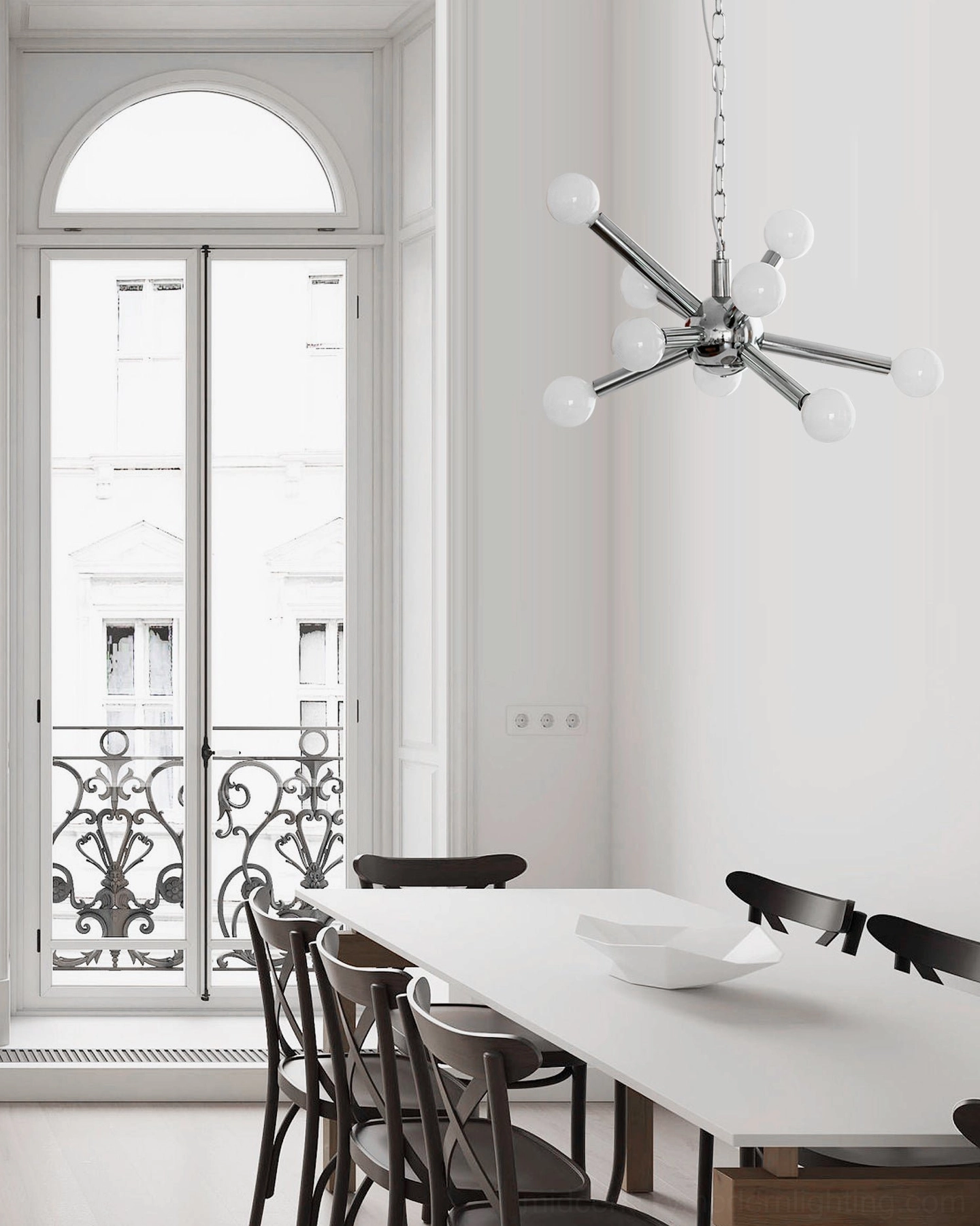 Sputnik chandelier over round dining area, low angle view, chrome frame with white glass spheres, mid-century styling