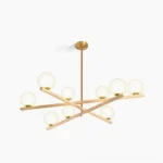 Modern sputnik globe chandelier with 9 frosted white opal shades, gold metal framework and warm wood-textured arms on white background