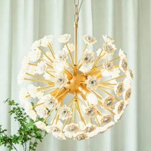 Brass gold floral sputnik chandelier displayed in luxury interior with sheer white curtains and green foliage