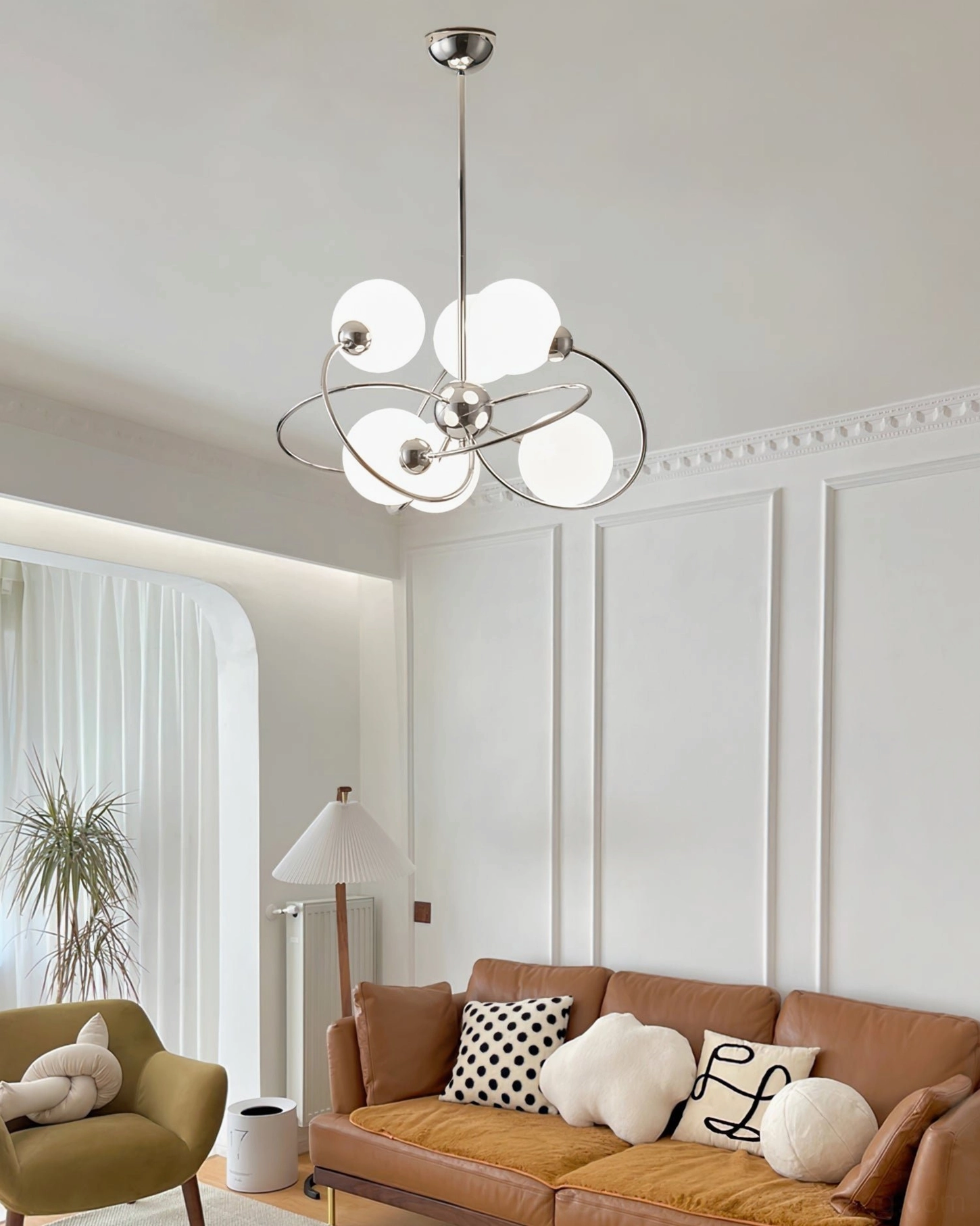 Sputnik space age chandelier installed in French style warm living room interior