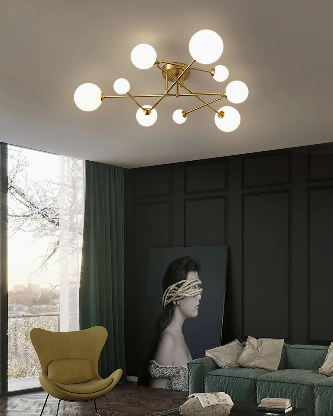 Sputnik ceiling lamp with brass gold frame and round frosted glass shades in modern living room with green accent