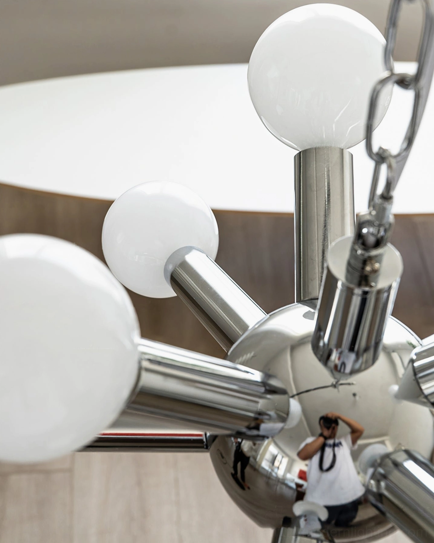 Sputnik chandelier suspension detail, chrome hanging chain, white frosted glass sphere, mid-century fixture