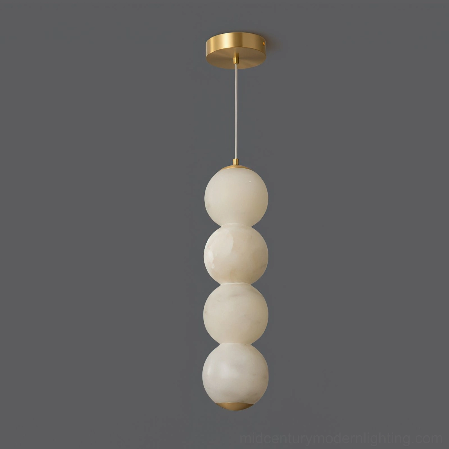 Stacked alabaster globe pendant light front view minimal brass hardware accent design