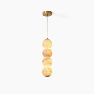 Stacked alabaster globe pendant light with brass hardware on white background, front view