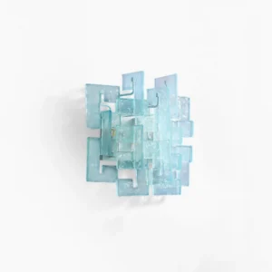 Stagger cast glass wall sconce front view studio shot aqua blue textured glass geometric design
