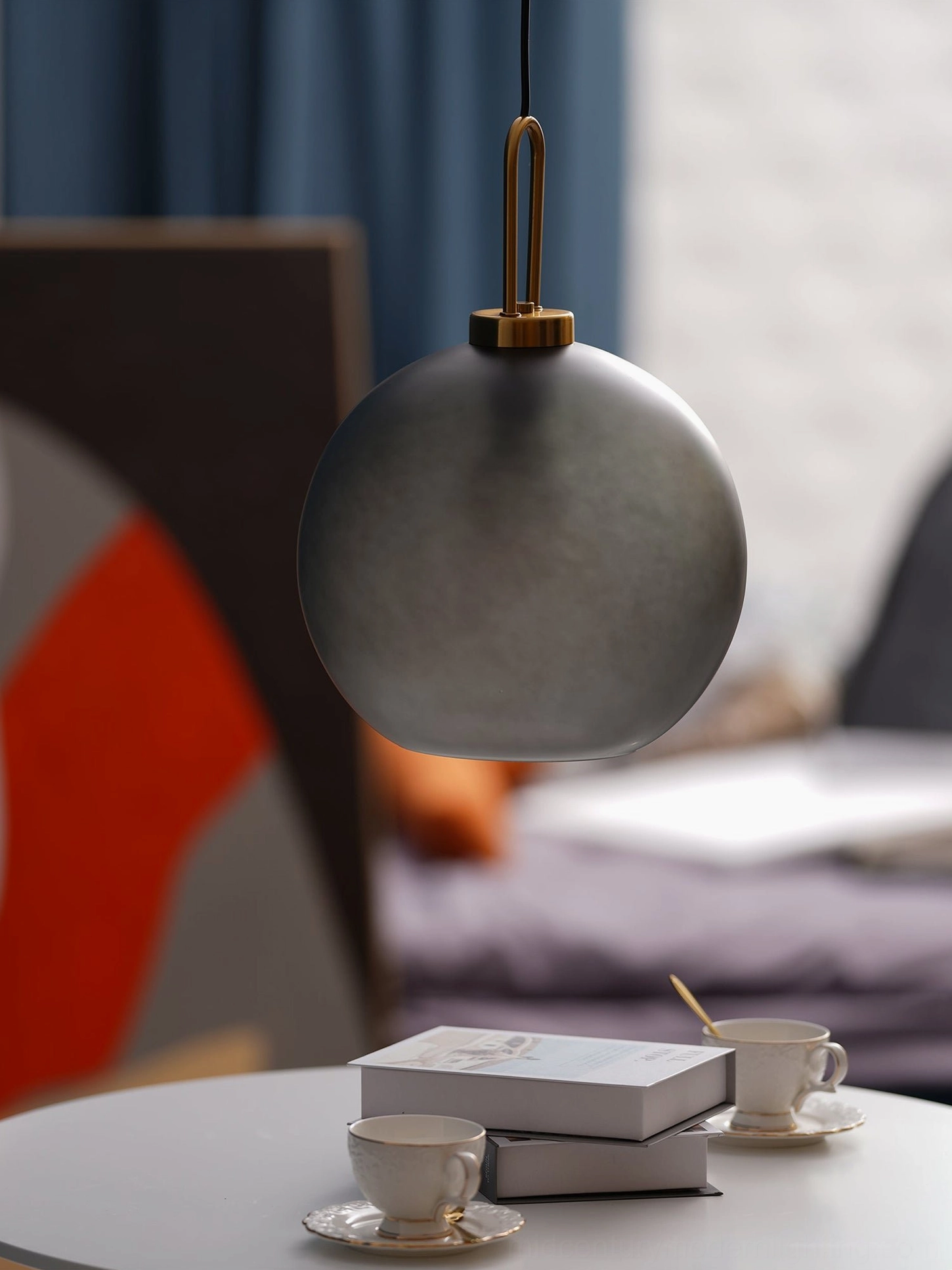 Staggered height smoked glass pendant lamp installation showing mid-century modern design versatility