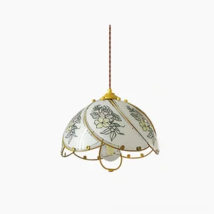 Handcrafted stained glass lily pendant lamp with polished brass frame and hand-painted yellow floral motif on frosted glass dome, studio front view