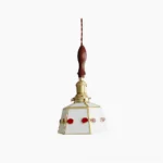 Handcrafted stained glass pendant lamp with polished brass frame and walnut handle—front studio view