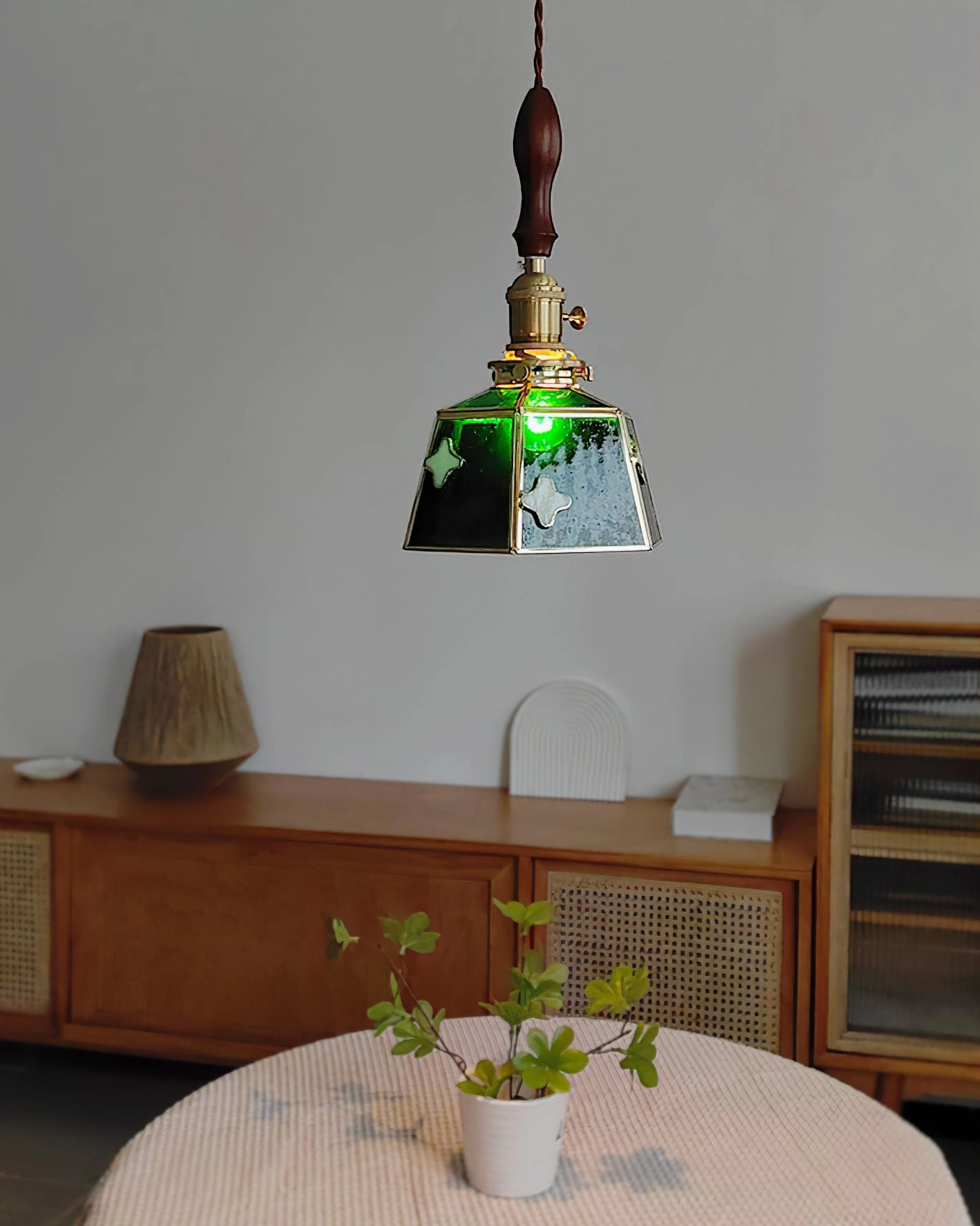 Full composition of stained glass pendant lamp showing proportion of shade, brass frame, and walnut top handle